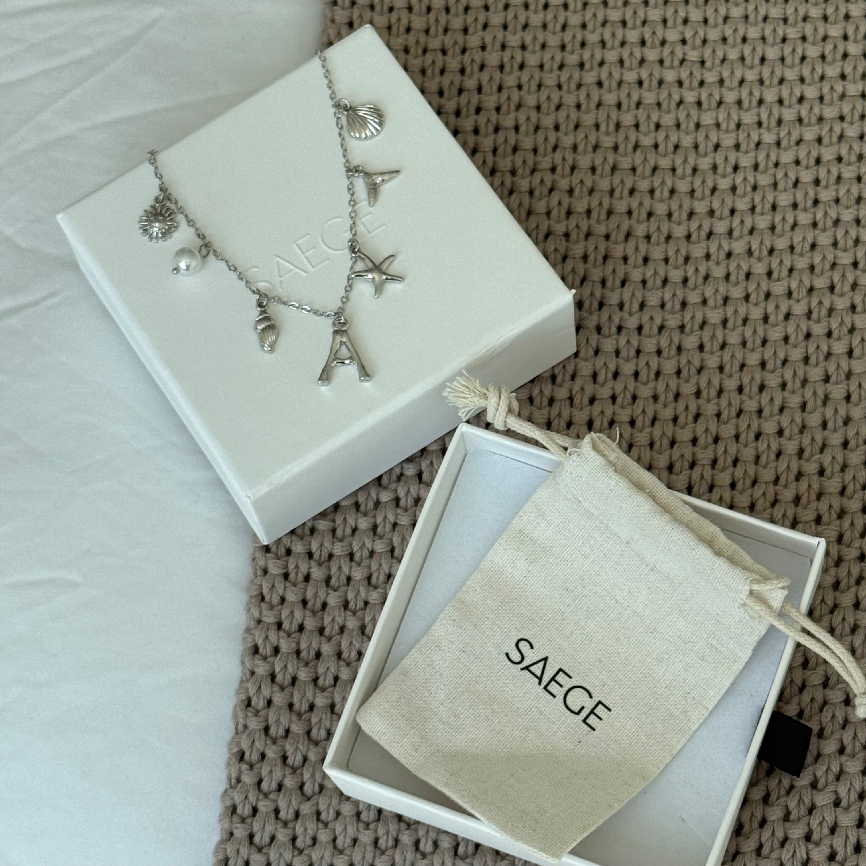 SILVER OCEAN LETTER NECKLACE